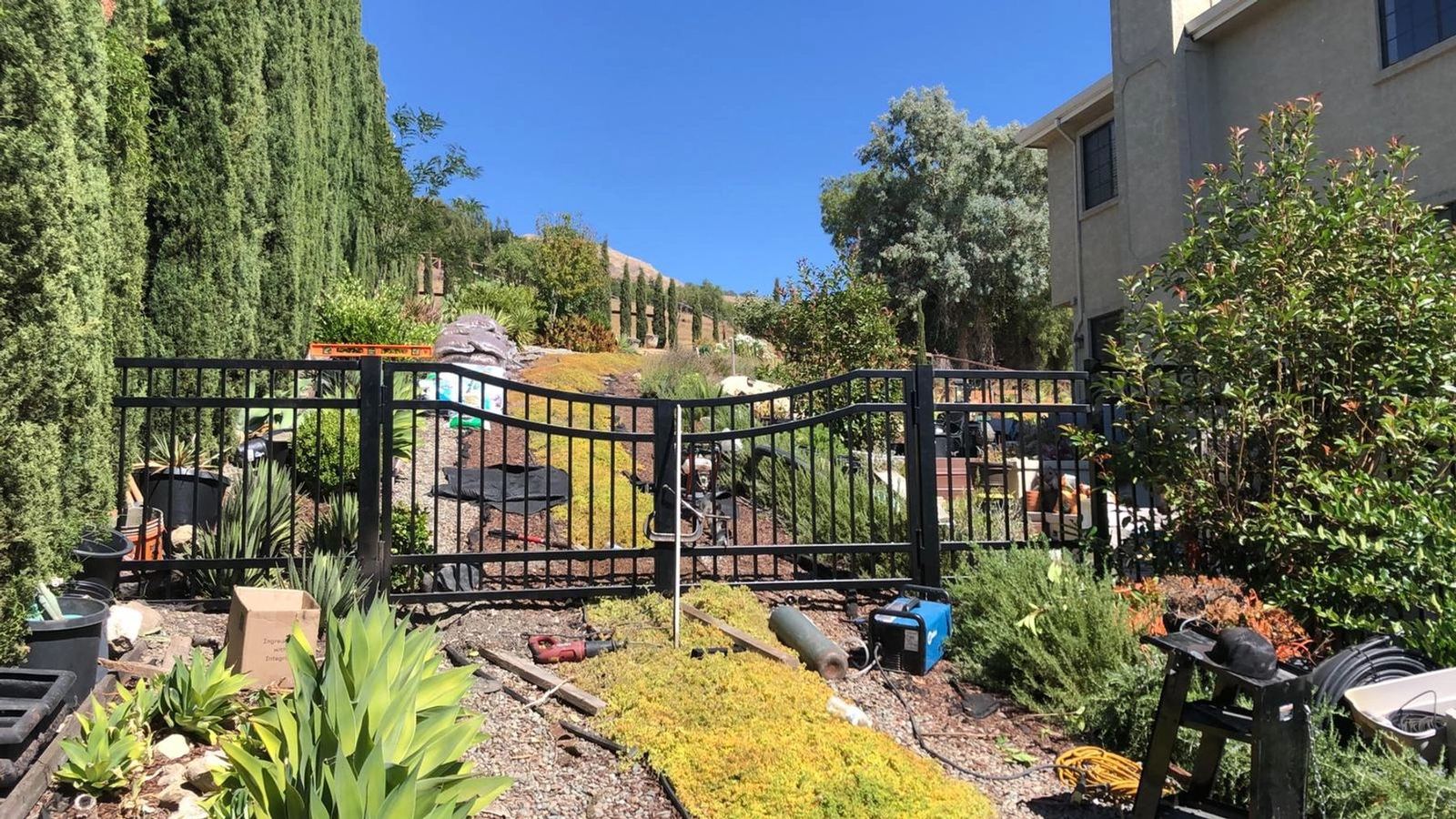 A black double perimeter gate installed at a residence, an ATR Welding installation