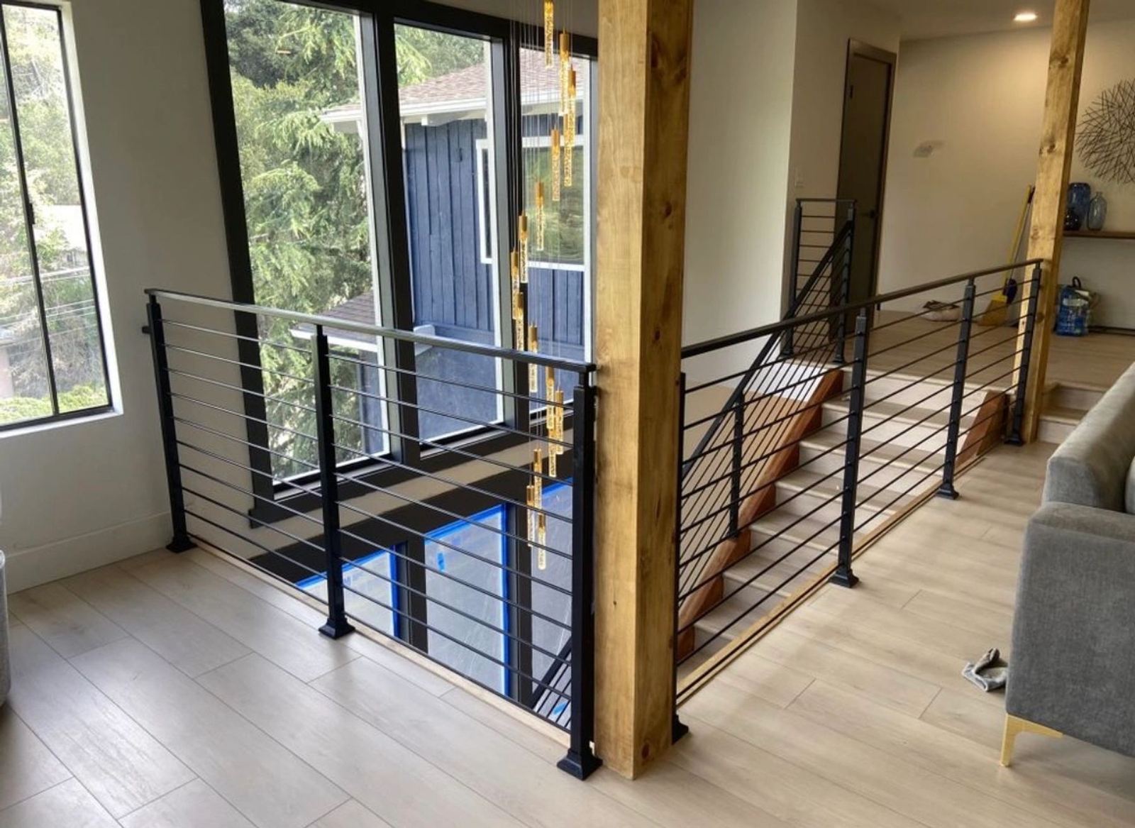 A modern horizontal cable railing on an interior loft landing